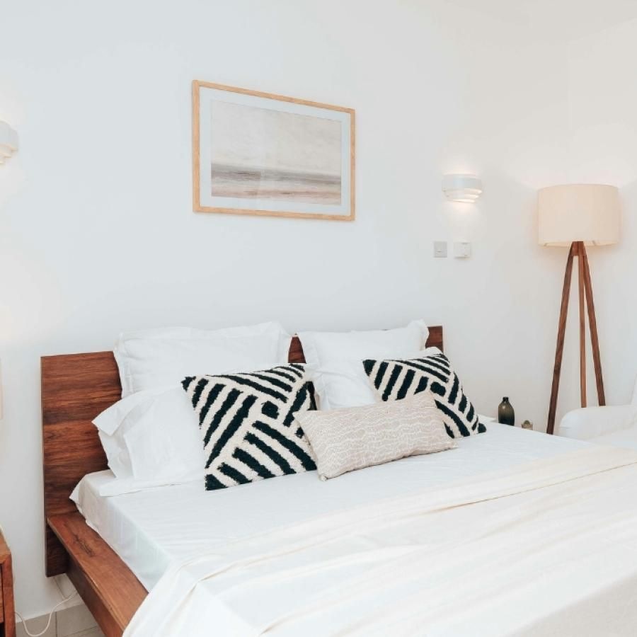 a bed with white pillows